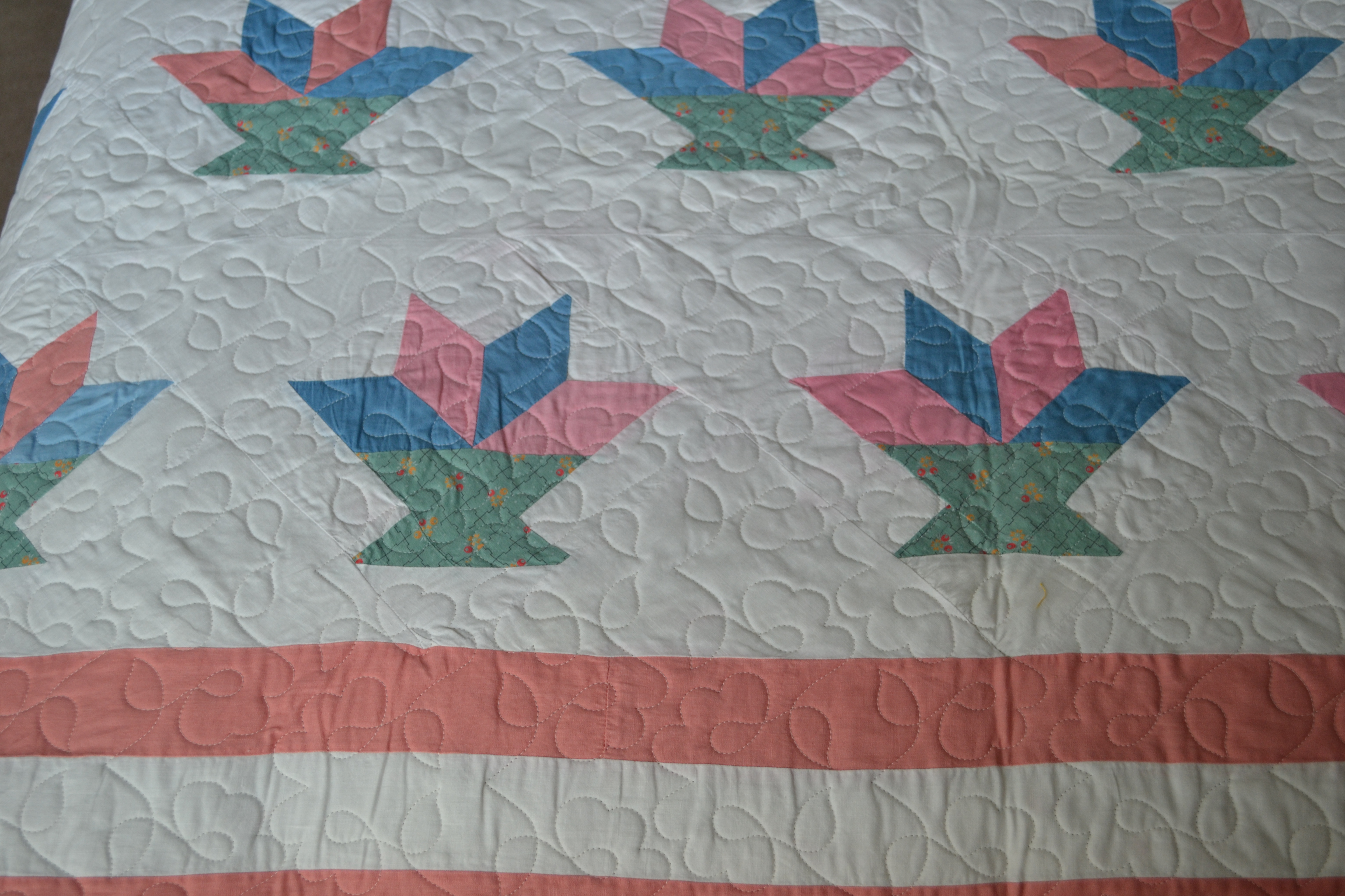 An antique quilt top that was cleaned and quilted